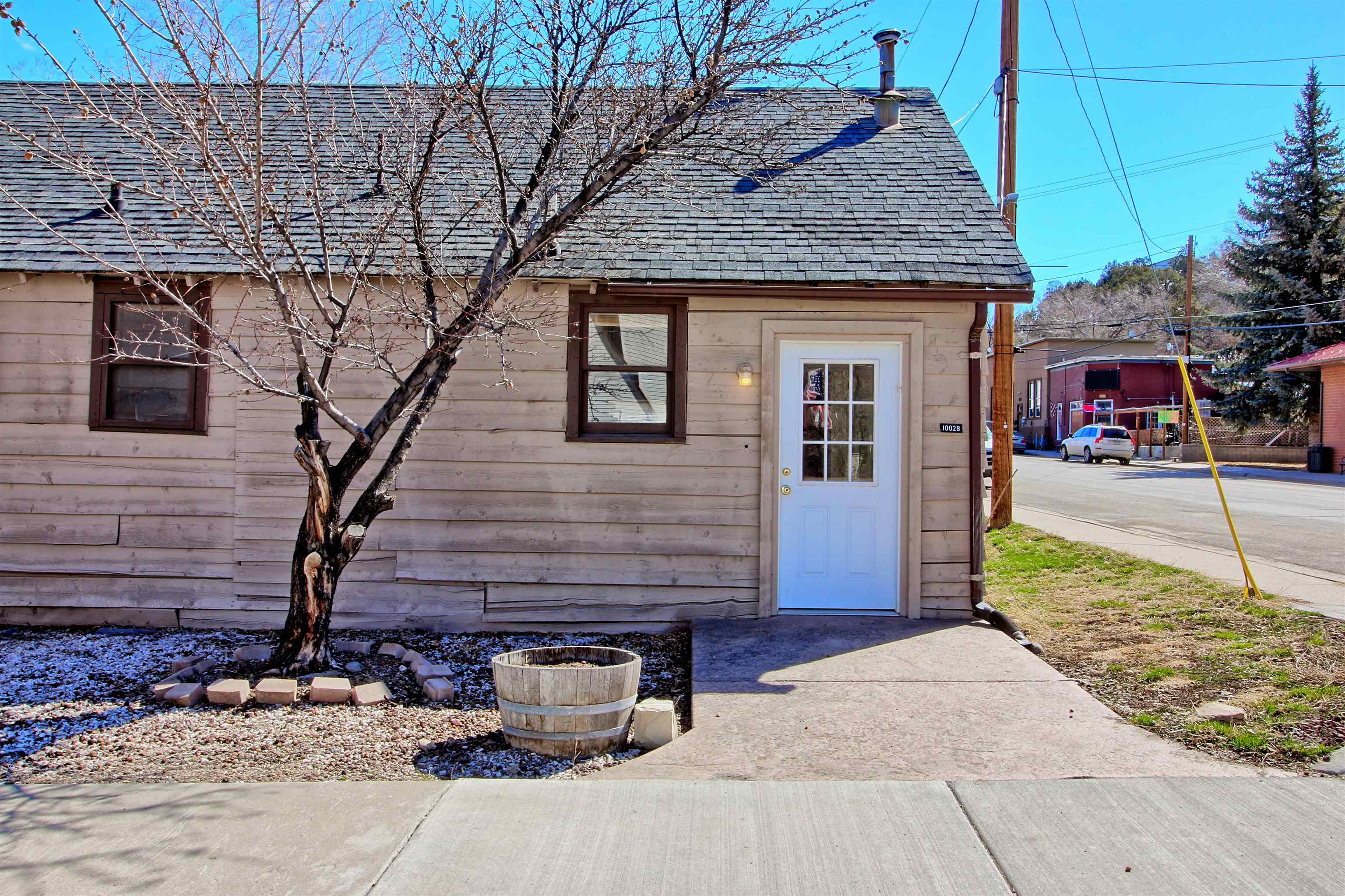 1002 Elm Avenue, Unit B Collbran, CO 81624 - Photo 2 of 17 a front view of a house with garden