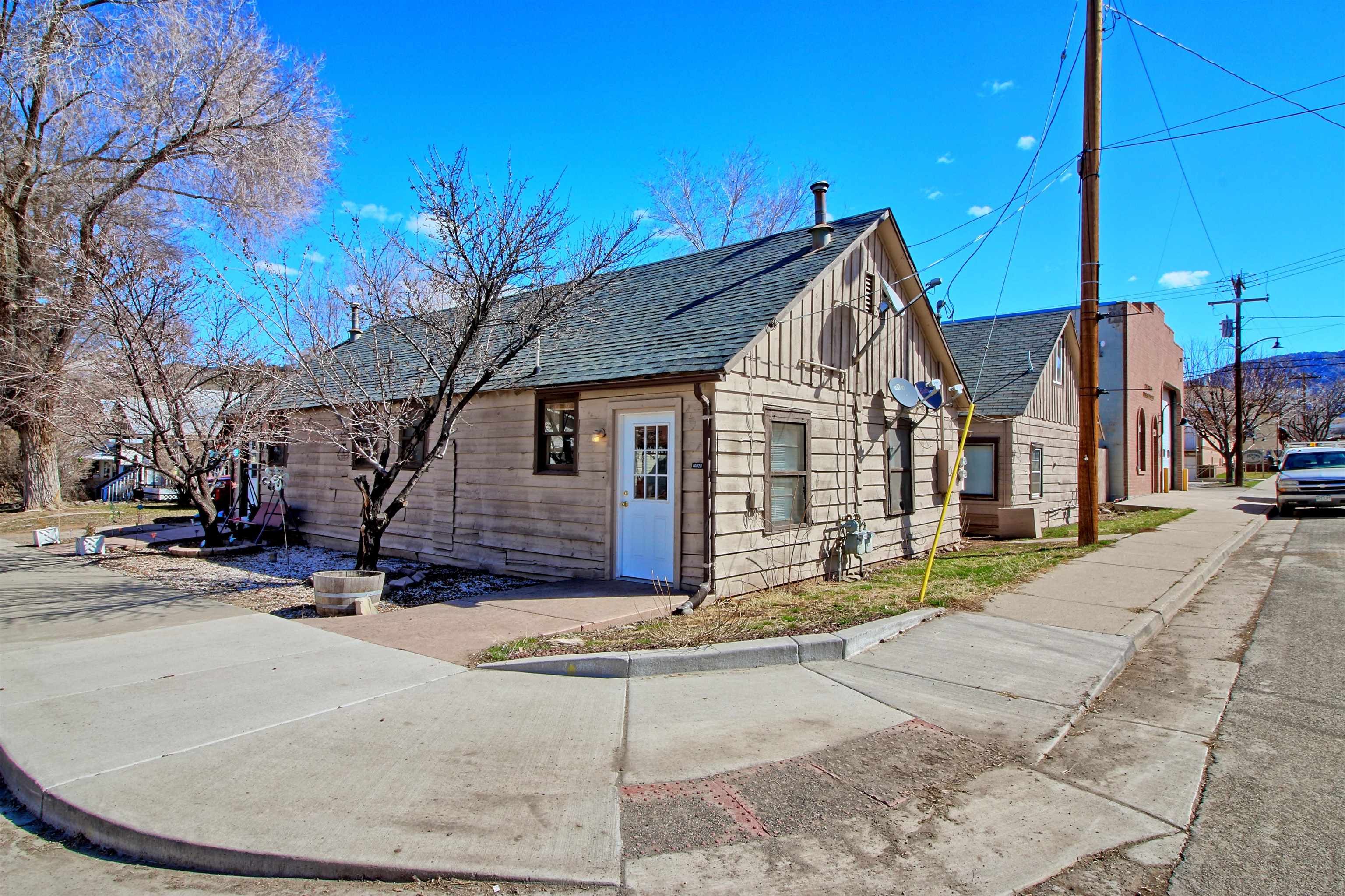 1002 Elm Avenue, Unit B Collbran, CO 81624 - Photo 3 of 17 a view of a house with snow on the side of it