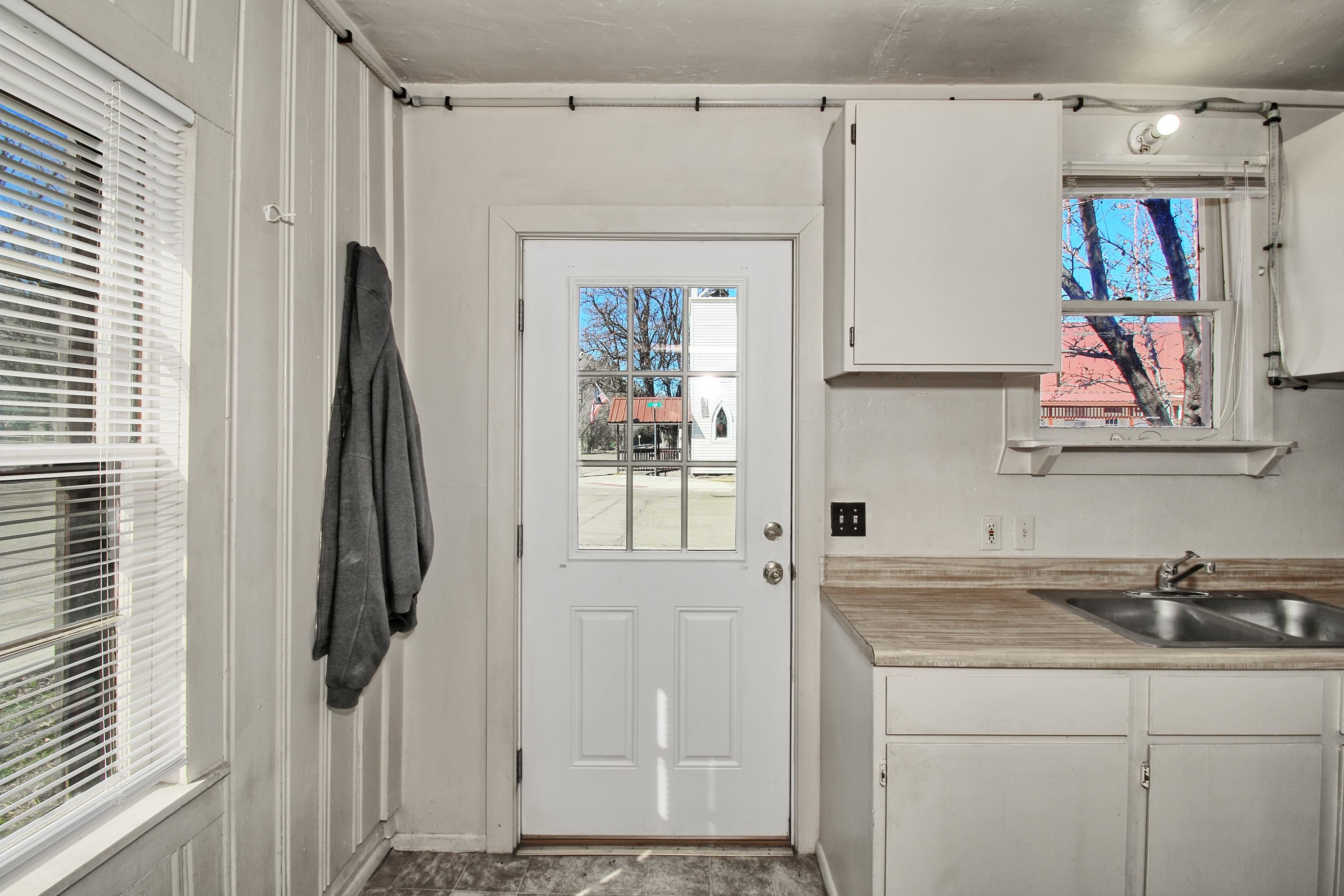 1002 Elm Avenue, Unit B Collbran, CO 81624 - Photo 6 of 17 a bathroom with a sink vanity and a mirror