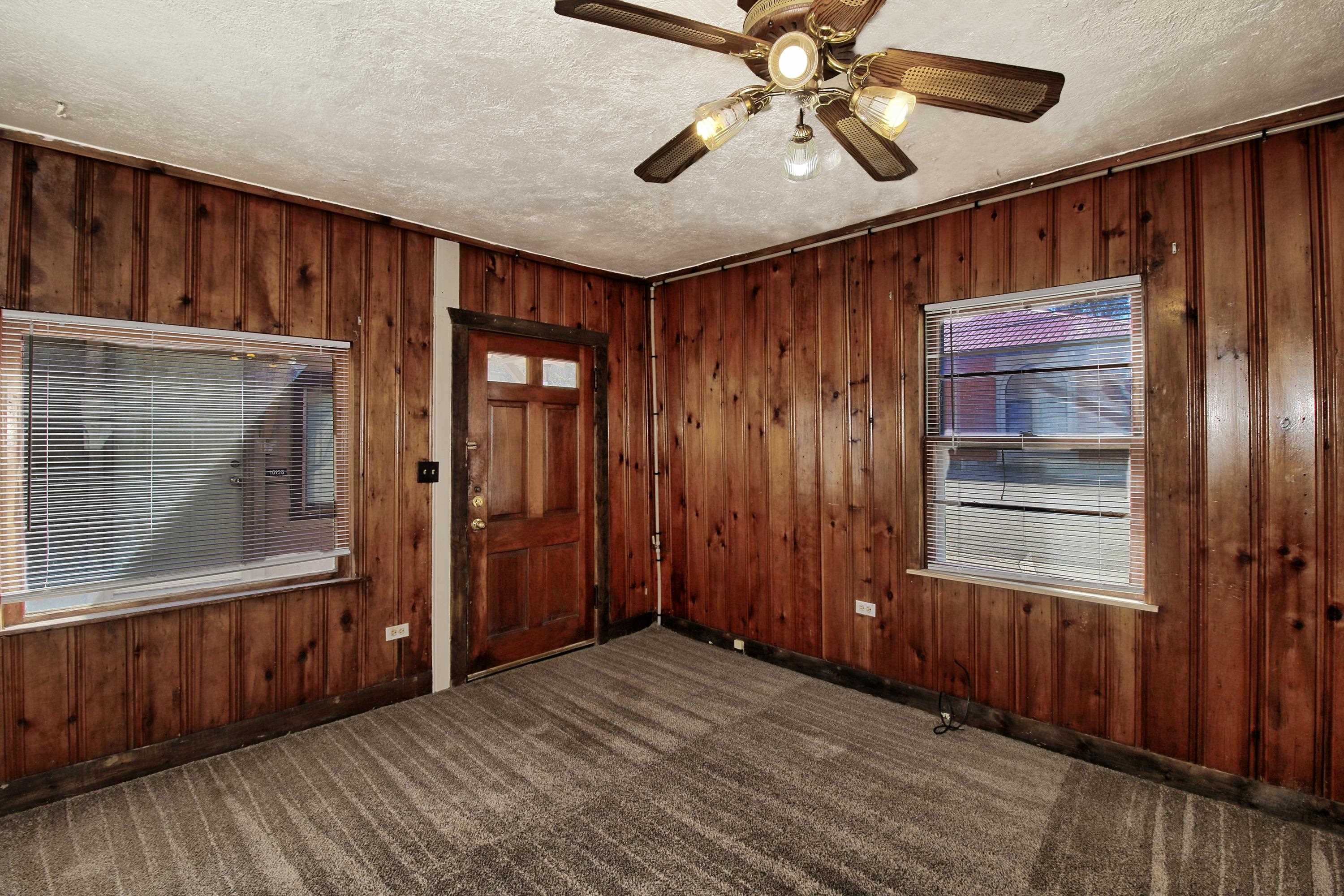 1002 Elm Avenue, Unit B Collbran, CO 81624 - Photo 8 of 17 a view of empty room with wooden floor and fan