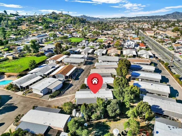 an aerial view of residential houses with outdoor space