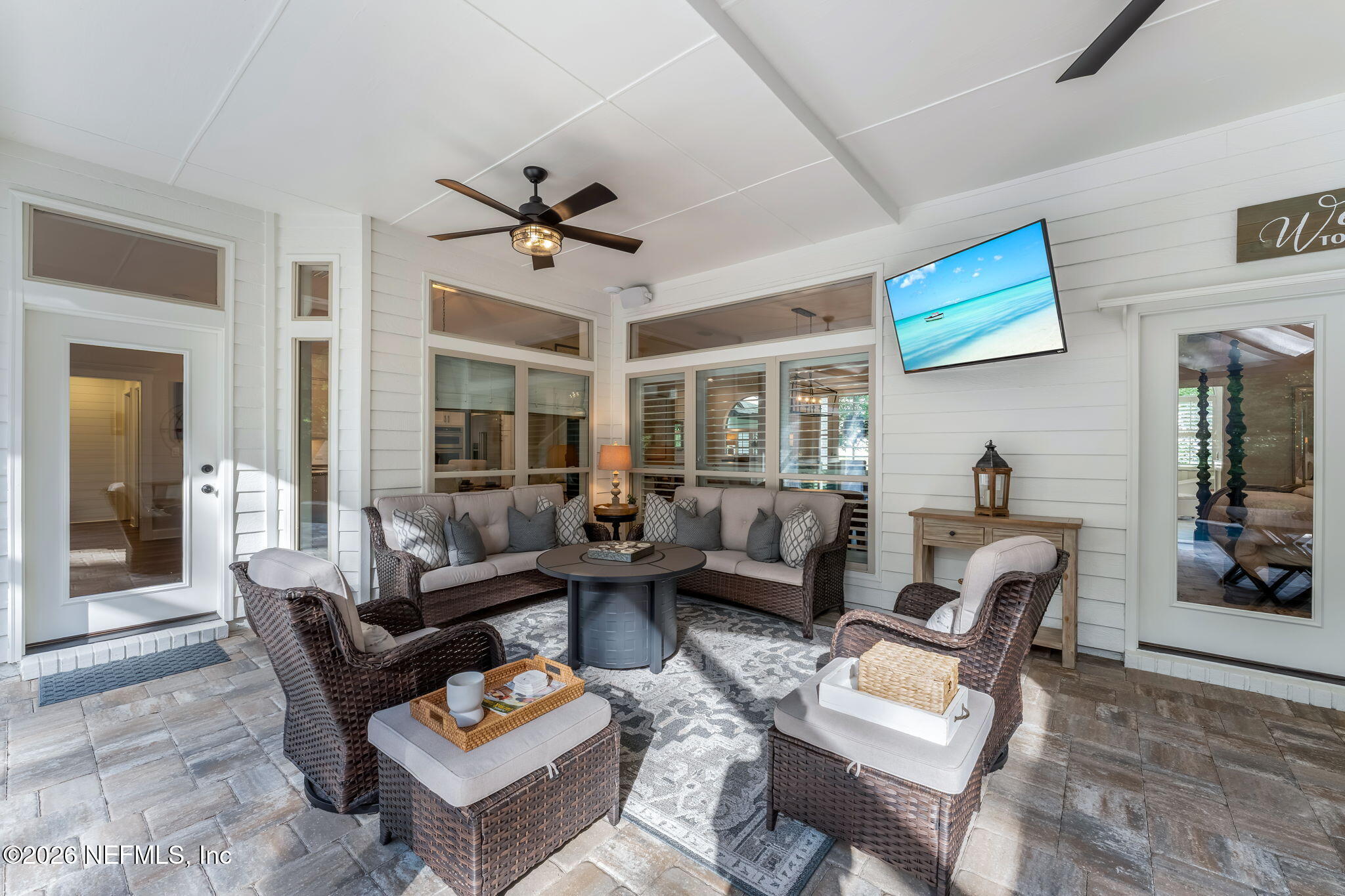 1204 Creek Bend Road St. Johns, FL 32259 - Photo 77 of 107 a living room with furniture a rug and a chandelier