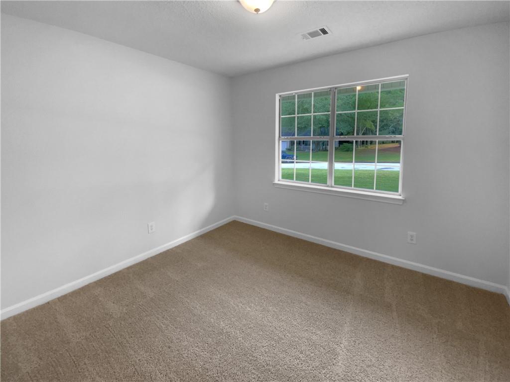 230 Myrtle Grove Lane Covington, GA 30014 - Photo 13 of 19 an empty room with a window