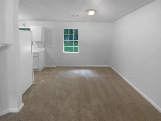 a view of empty room with windows