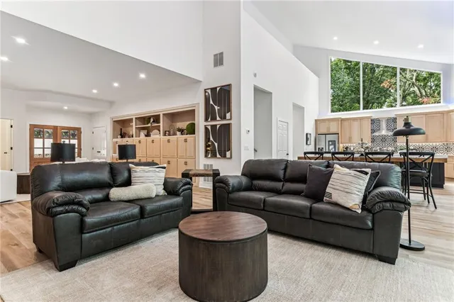 a kitchen with a sink stove and cabinets