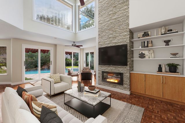 a kitchen with stainless steel appliances kitchen island granite countertop a refrigerator a stove and a sink