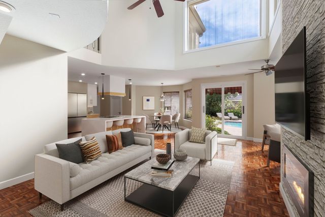 a living room with furniture and windows