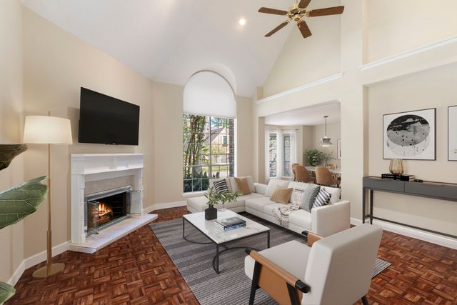 a living room with furniture fireplace and window