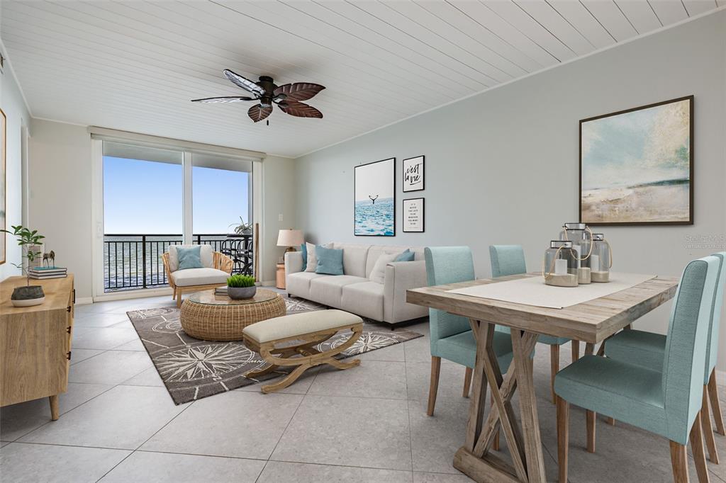 9 Haig Place, Unit 104 Dunedin, FL 34698 - Photo 3 of 59 a living room with furniture and a table