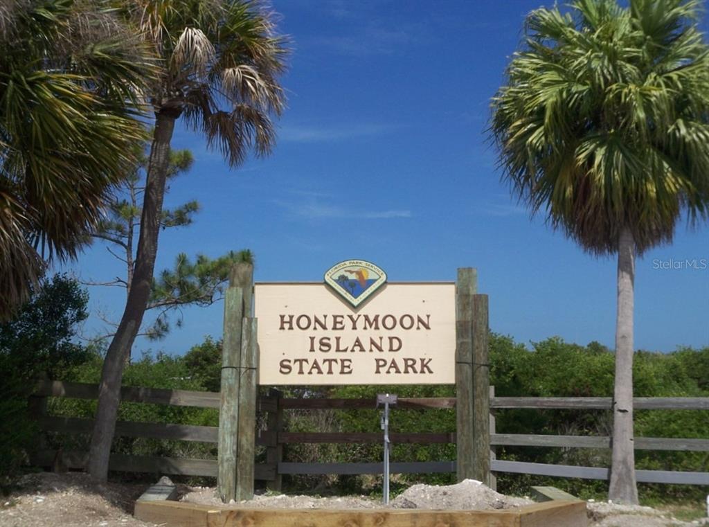 9 Haig Place, Unit 104 Dunedin, FL 34698 - Photo 47 of 59 a sign on the side of the road