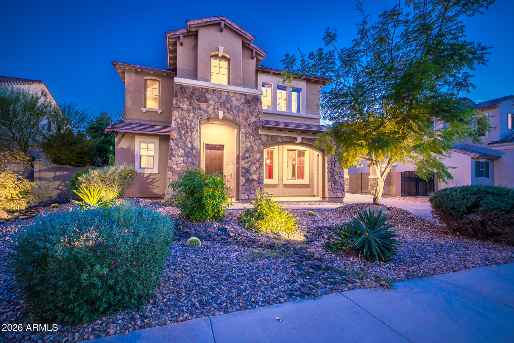 2681 East Hampton Lane Gilbert, AZ 85295 - Photo 1 of 88 a front view of a house with garden