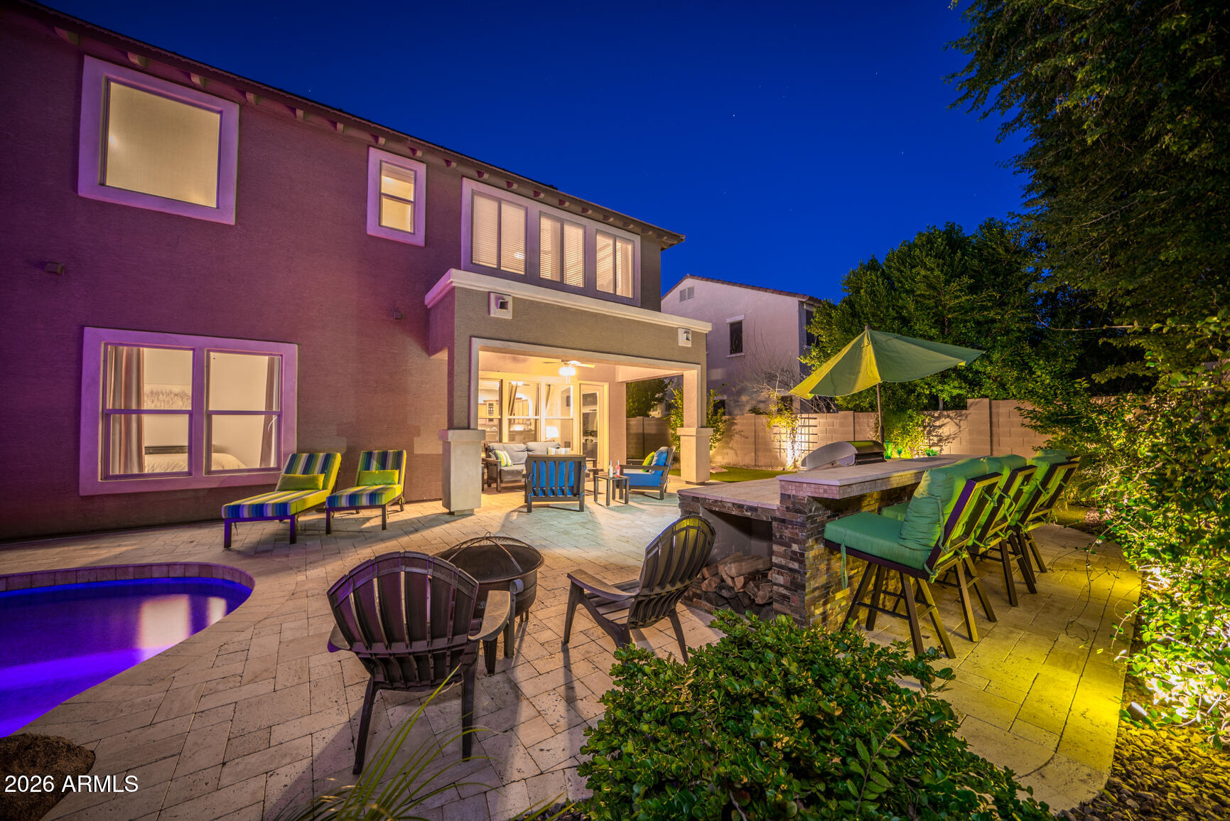 2681 East Hampton Lane Gilbert, AZ 85295 - Photo 2 of 88 a view of a patio with table and chairs and potted plants