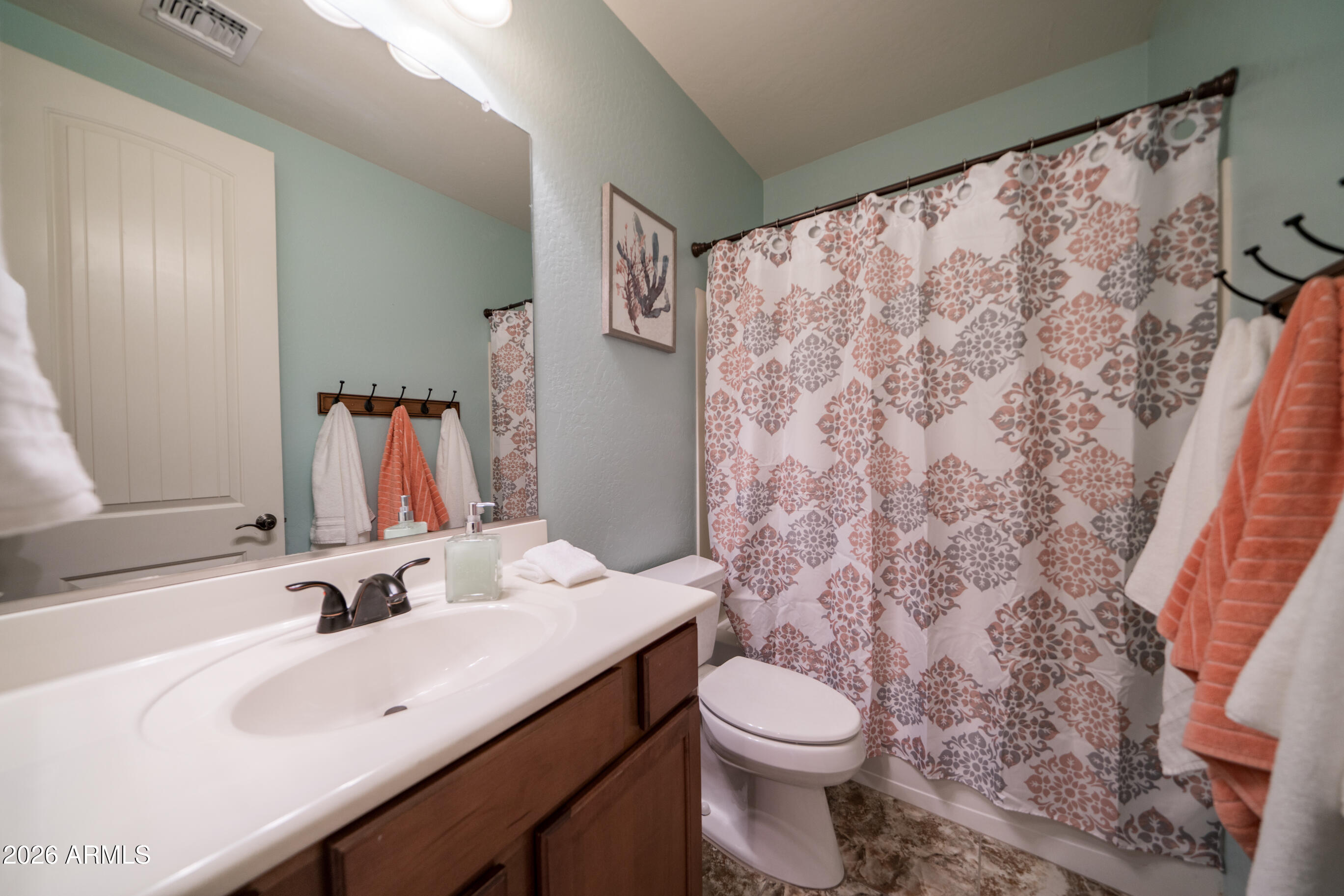 2681 East Hampton Lane Gilbert, AZ 85295 - Photo 29 of 88 a bathroom with a sink and a mirror
