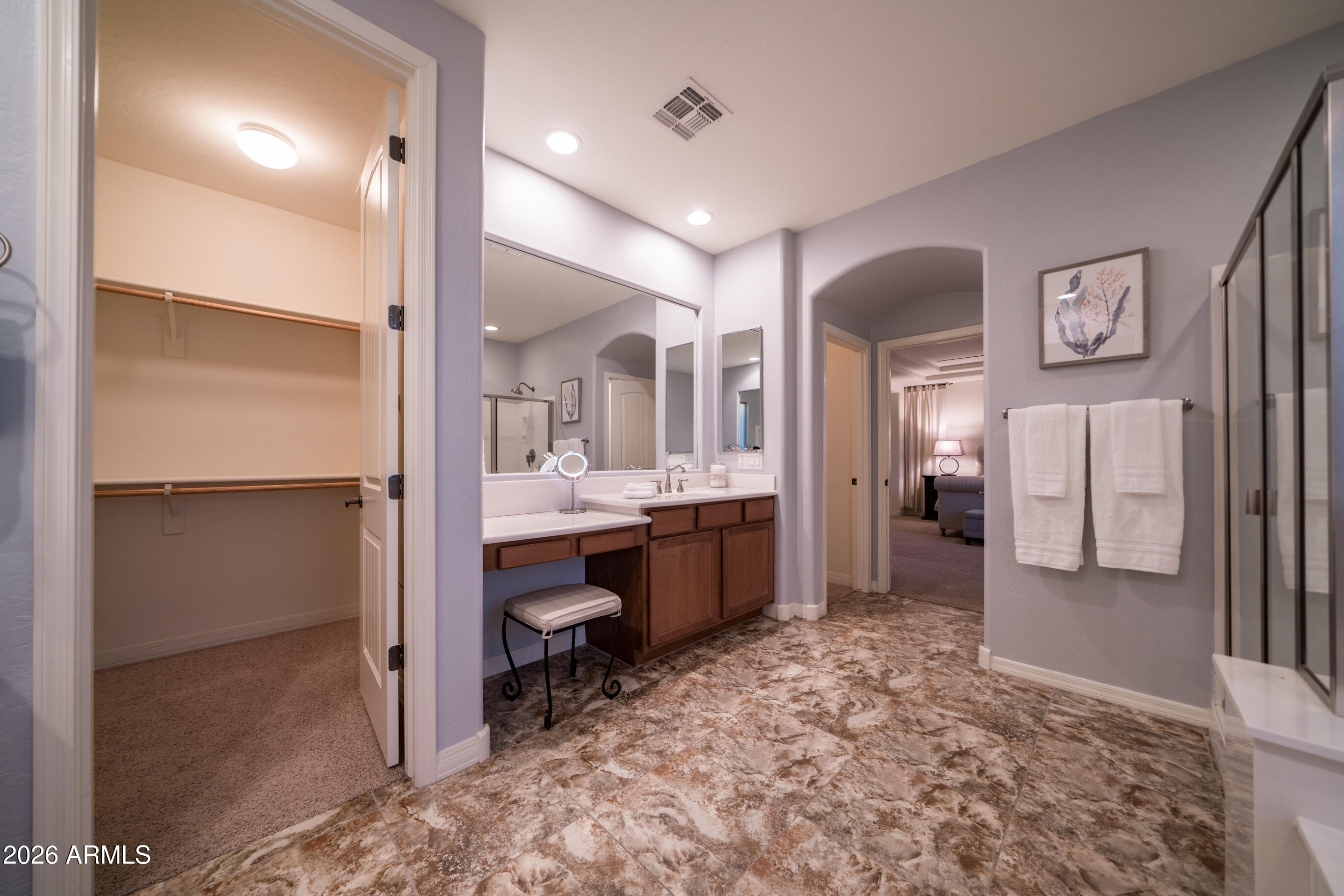 2681 East Hampton Lane Gilbert, AZ 85295 - Photo 37 of 88 a large bathroom with a glass door shower and sink