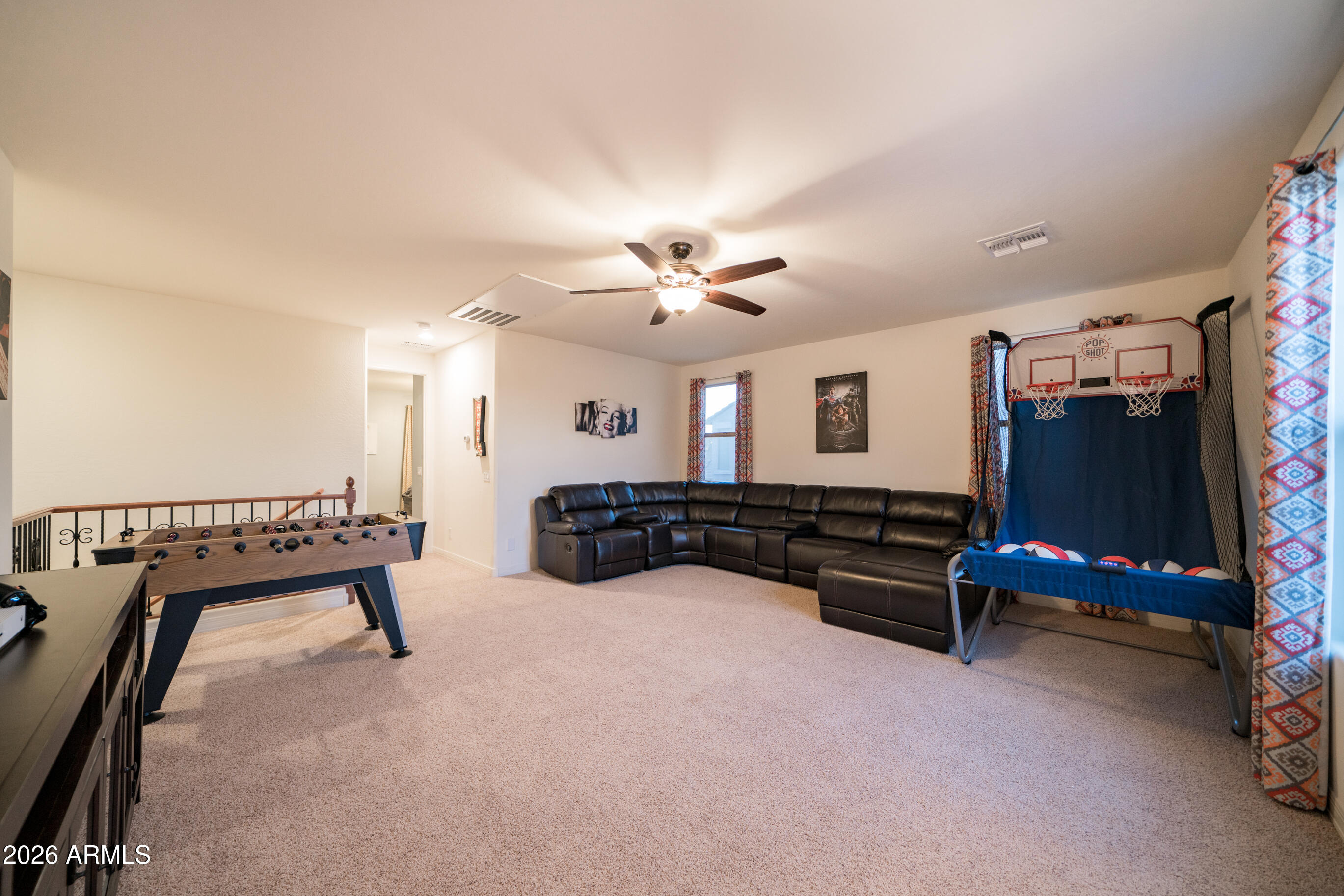 2681 East Hampton Lane Gilbert, AZ 85295 - Photo 42 of 88 a living room with furniture gym equipment and a flat screen tv