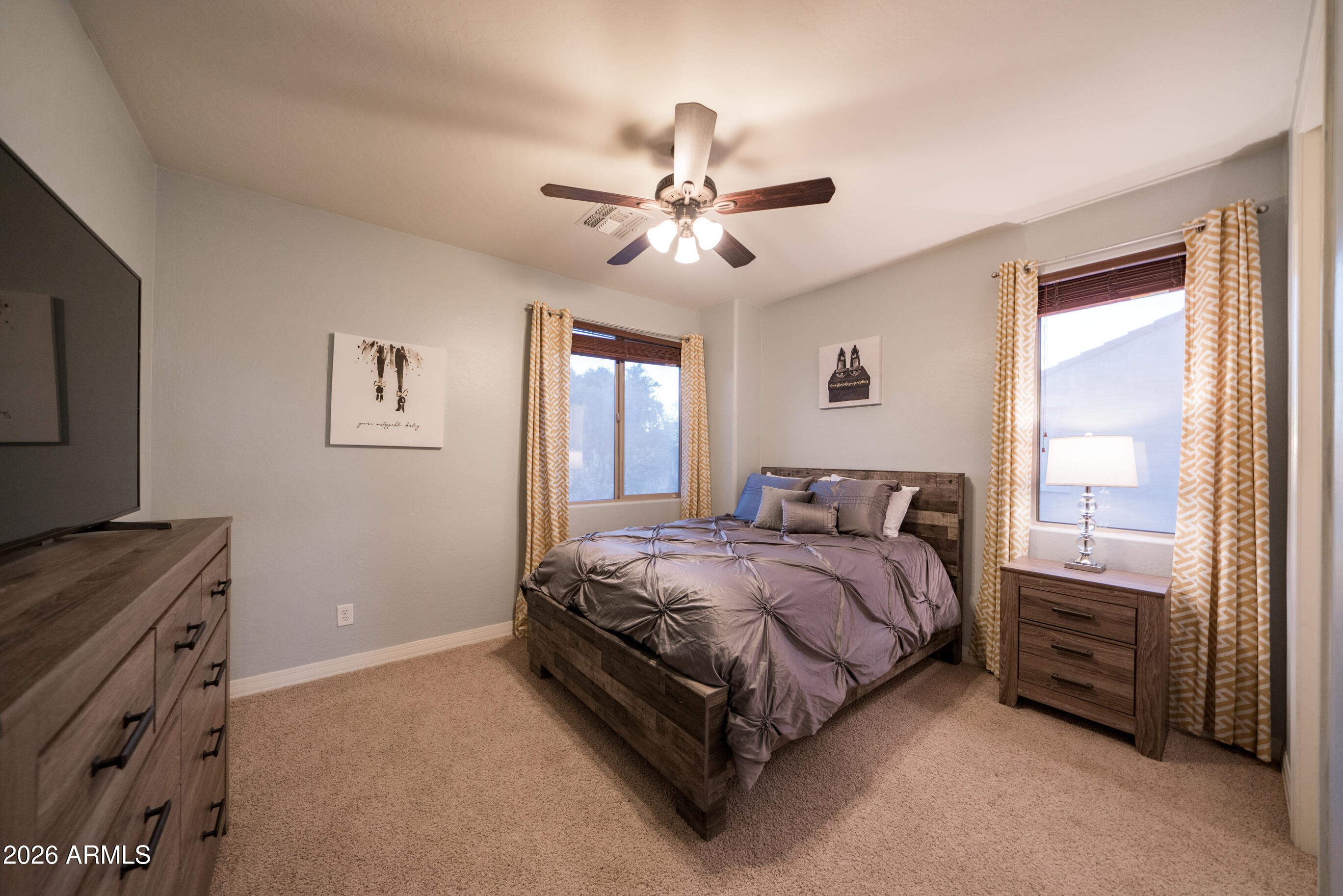 2681 East Hampton Lane Gilbert, AZ 85295 - Photo 43 of 88 a bed room with a bed and a ceiling fan