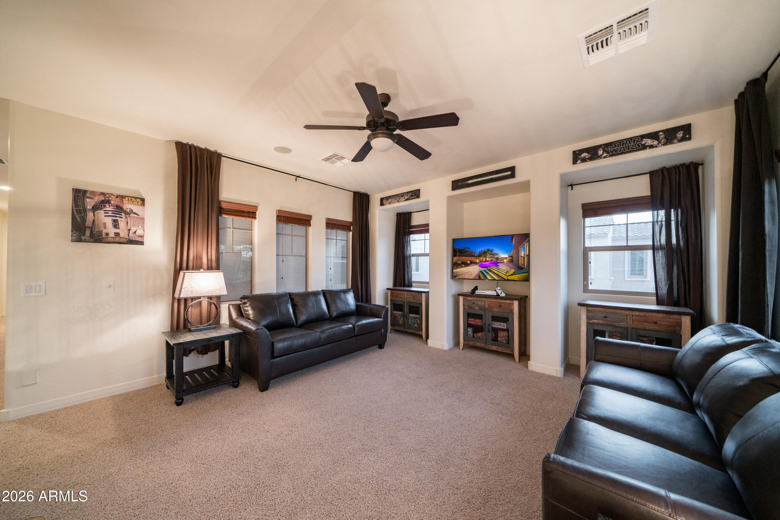 2681 East Hampton Lane Gilbert, AZ 85295 - Photo 53 of 88 a living room with furniture and a flat screen tv