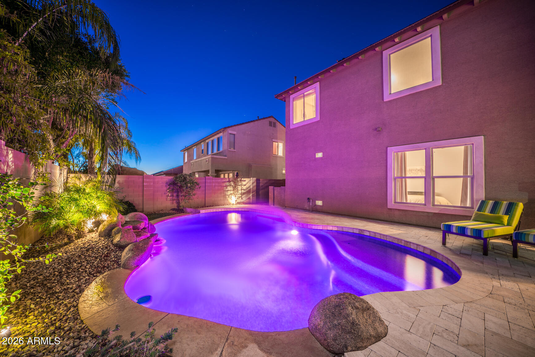 2681 East Hampton Lane Gilbert, AZ 85295 - Photo 59 of 88 a view of a pool with a dining table and chairs
