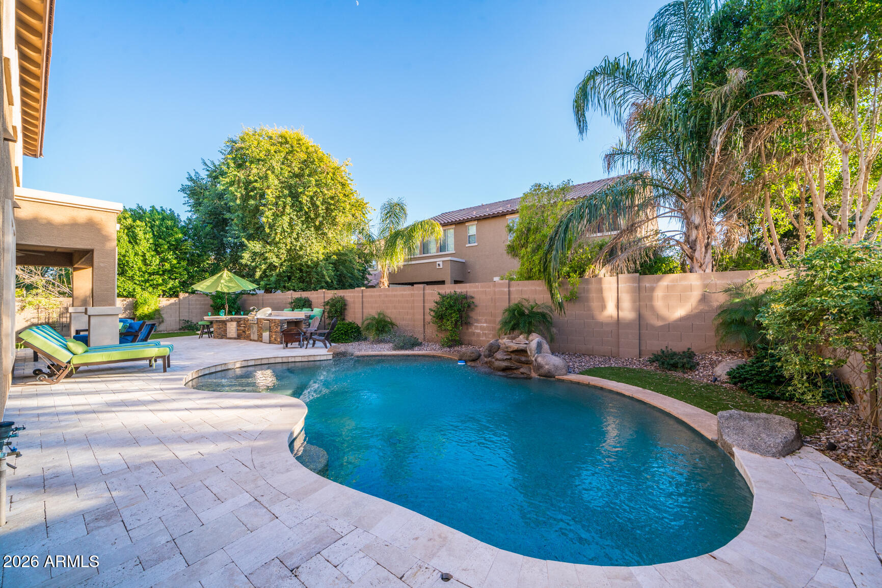 2681 East Hampton Lane Gilbert, AZ 85295 - Photo 66 of 88 a view of a swimming pool with a sitting space