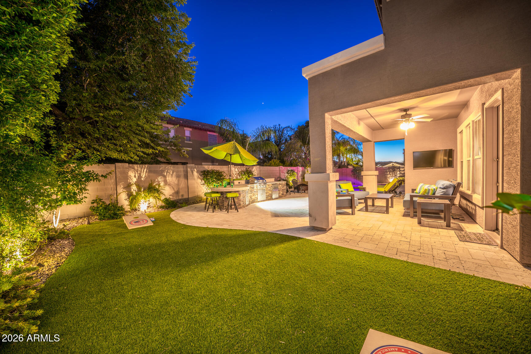 2681 East Hampton Lane Gilbert, AZ 85295 - Photo 7 of 88 a view of a patio with table and chairs and potted plants