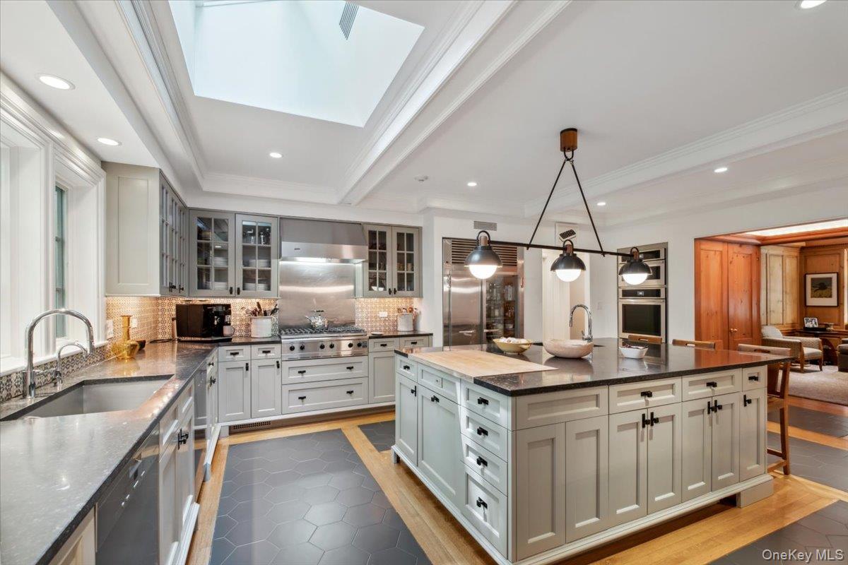 18 Richbell Road Scarsdale, NY 10583 - Photo 15 of 40 Chef's kitchen, timeless design and modern functionality. Custom cabinetry and artisan tile backsplash.
