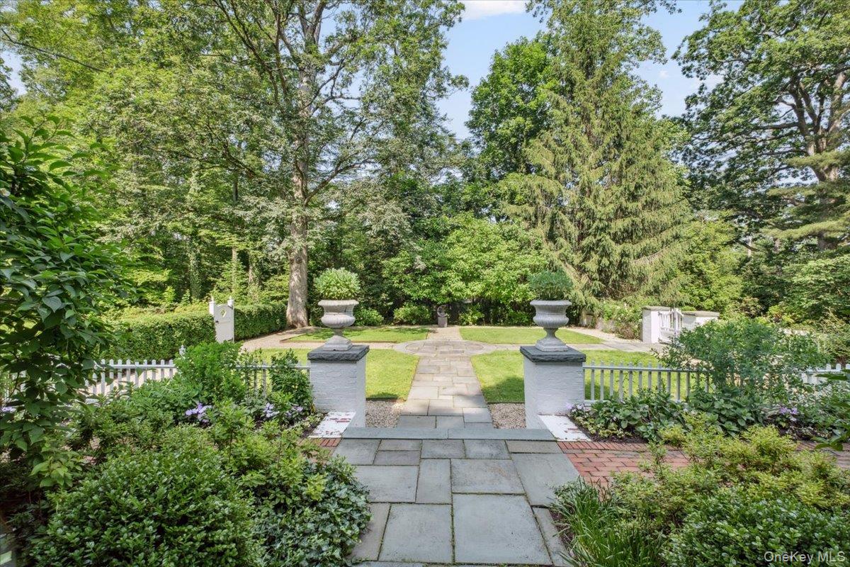 18 Richbell Road Scarsdale, NY 10583 - Photo 2 of 40 A stunning manicured fenced in courtyard, with stone walkways