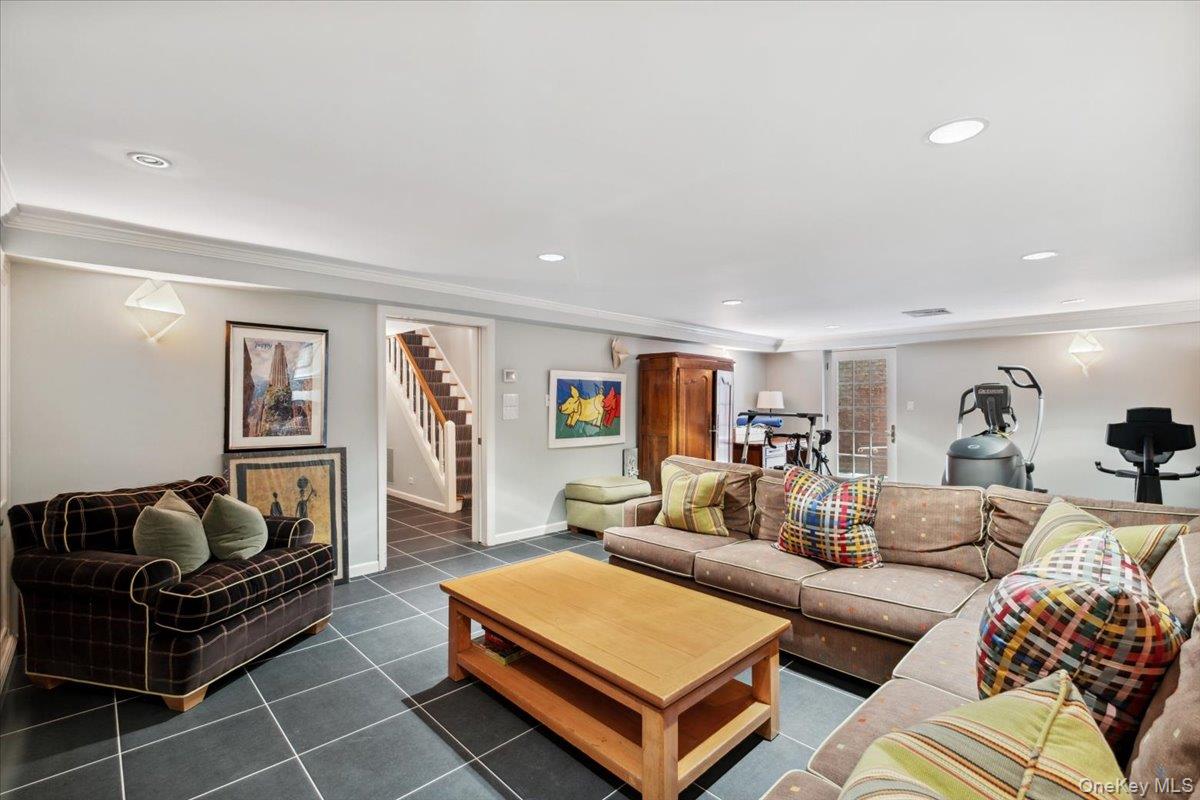 18 Richbell Road Scarsdale, NY 10583 - Photo 35 of 40 Lower level recreation room, tiled floor, access to outside, full bathroom, mechanicals