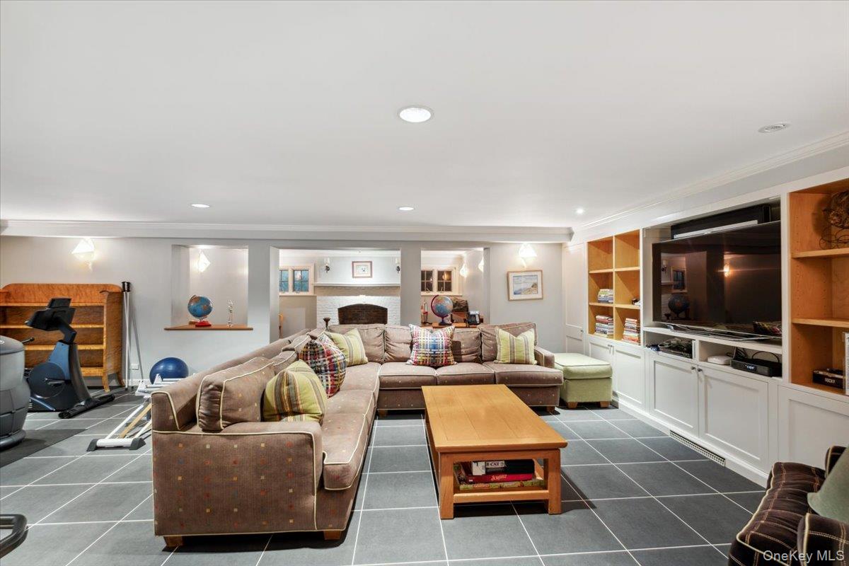 18 Richbell Road Scarsdale, NY 10583 - Photo 36 of 40 Lower level recreation room with fireplace