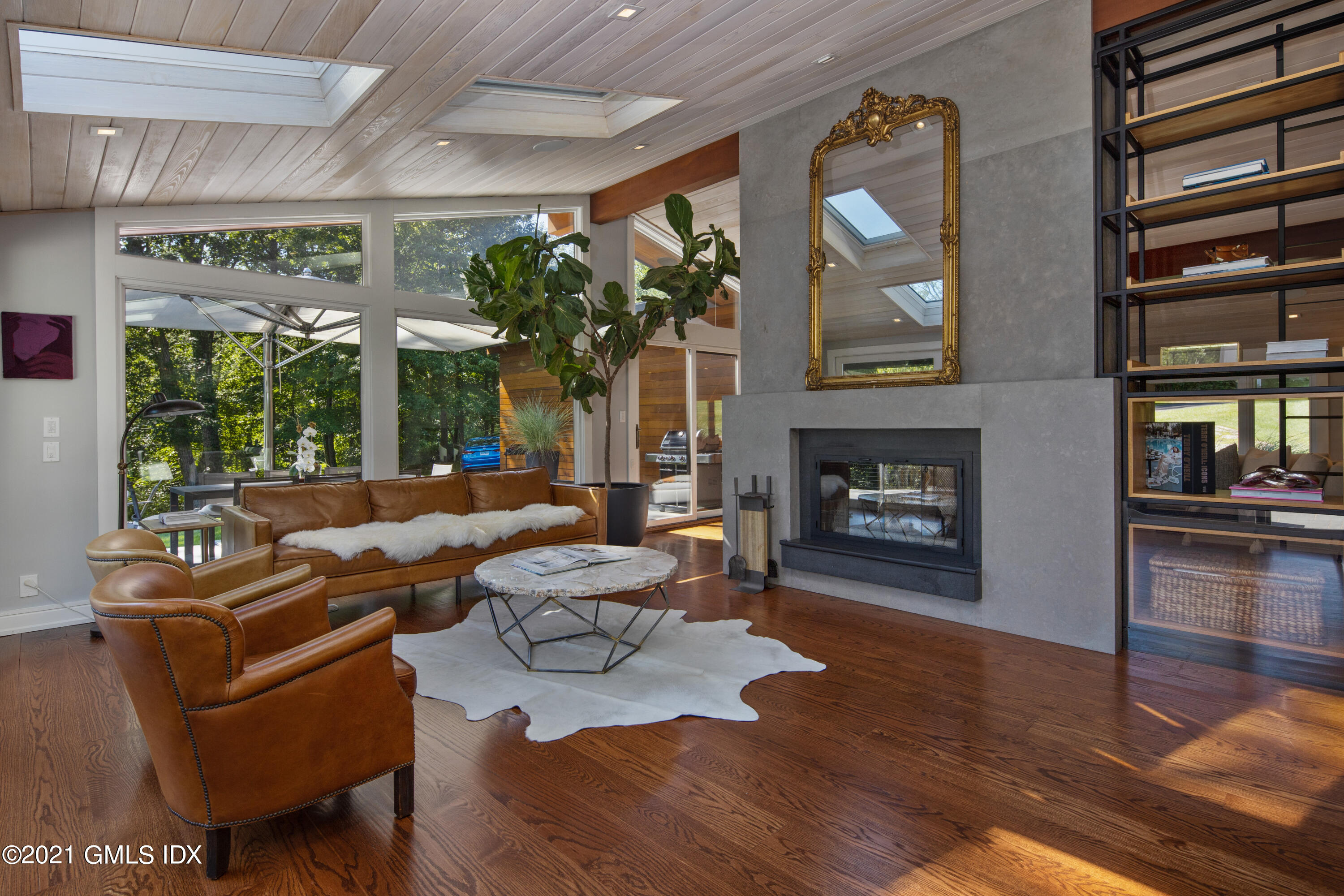 11 Old Forge Road Greenwich, CT 06830 - Photo 16 of 34 a living room with furniture fireplace and flat screen tv