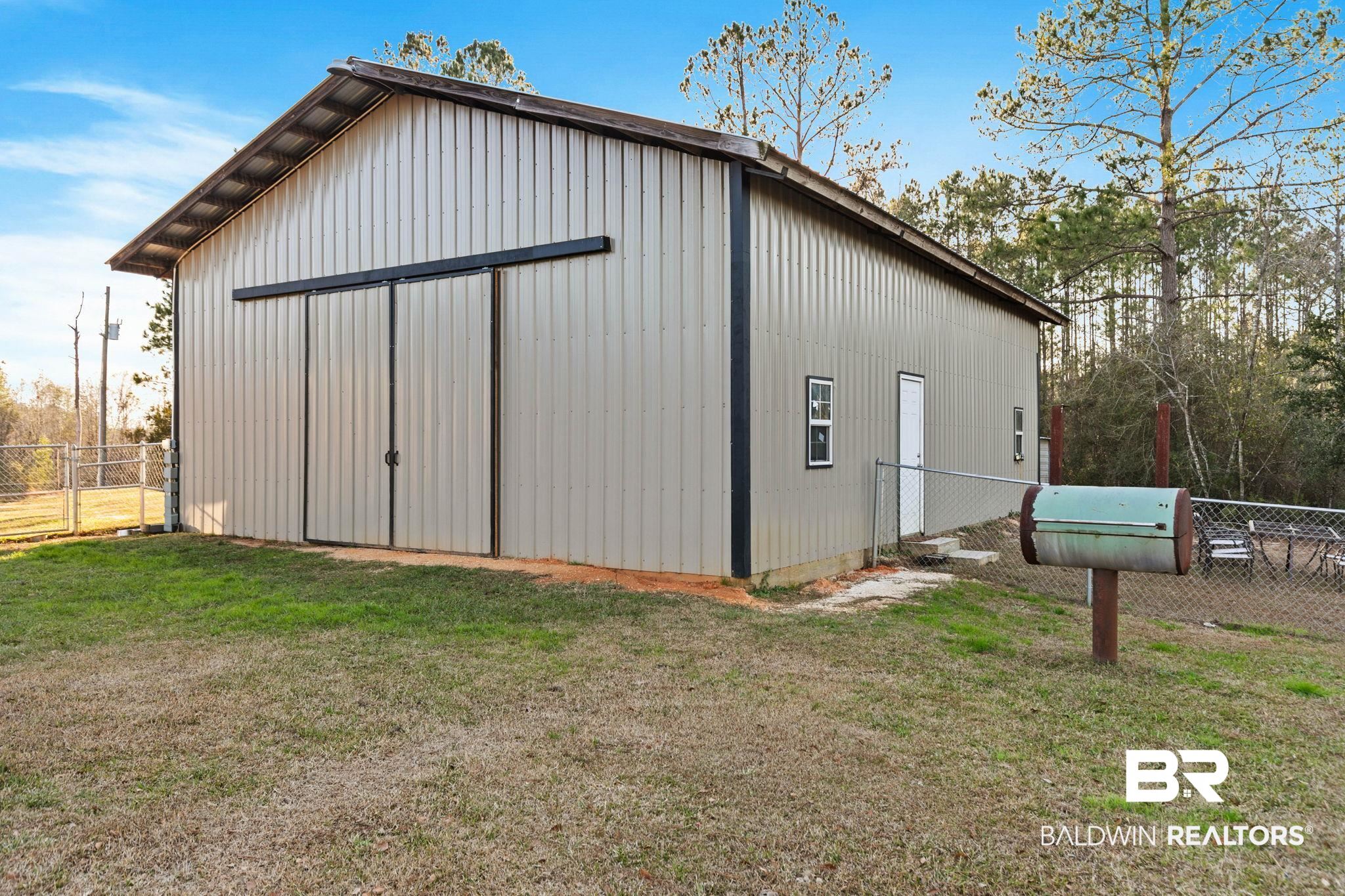 55750 Lottie Road Perdido, AL 36562 - Photo 33 of 84 View of pole building featuring a gate