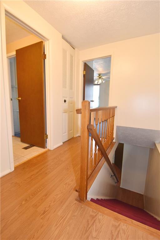32 Shadow Drive Pittsburgh, PA 15227 - Photo 11 of 24 a view of a hallway with wooden floor and staircase