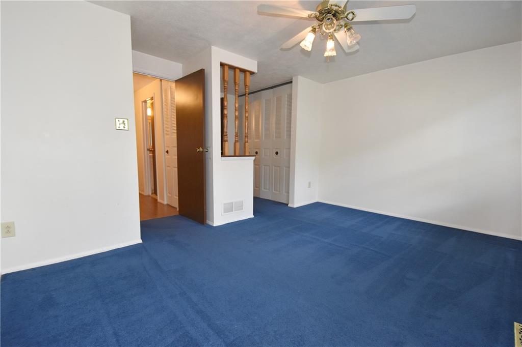 32 Shadow Drive Pittsburgh, PA 15227 - Photo 13 of 24 a view of an empty room with chandelier fan and wooden floor
