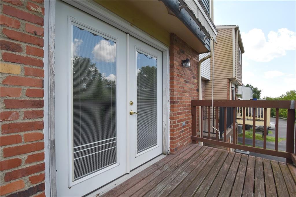 32 Shadow Drive Pittsburgh, PA 15227 - Photo 22 of 24 a view of a balcony with wooden floor and fence