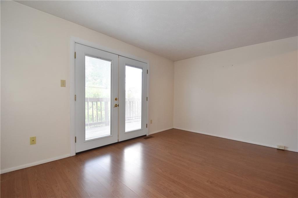 32 Shadow Drive Pittsburgh, PA 15227 - Photo 3 of 24 a view of an empty room with wooden floor and a window