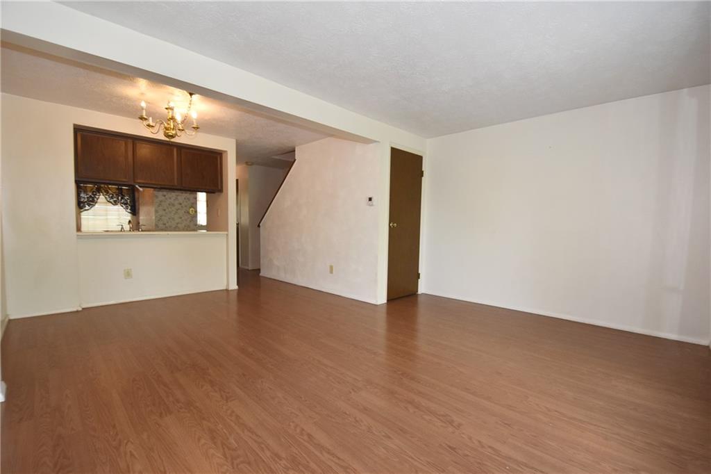 32 Shadow Drive Pittsburgh, PA 15227 - Photo 5 of 24 an empty room with wooden floor and mirror