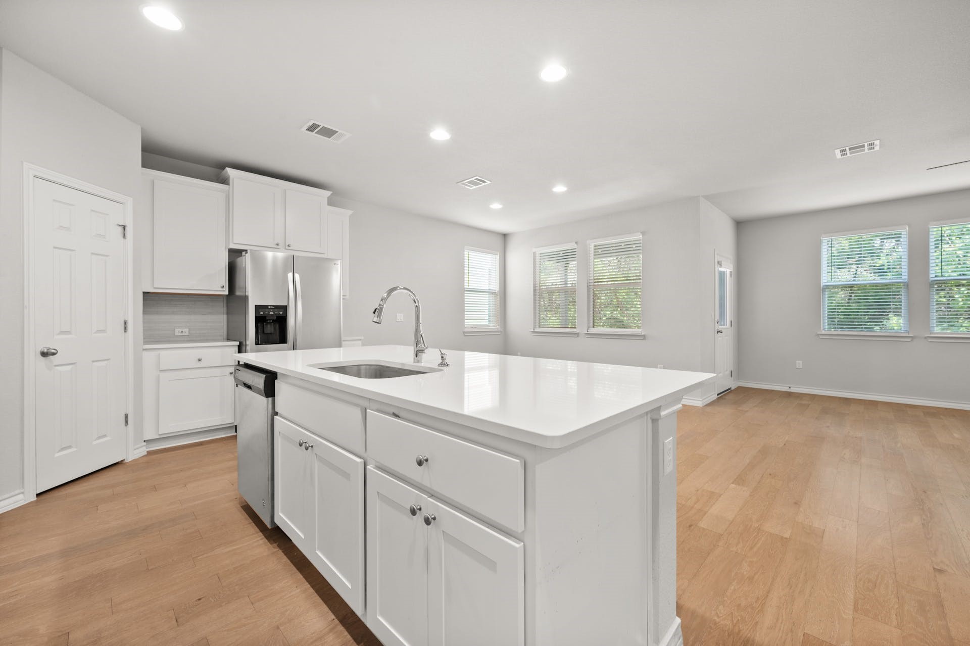 5107 Lemon Tree Path, Unit 127 Austin, TX 78723 - Photo 11 of 40 a kitchen with kitchen island a sink appliances and cabinets