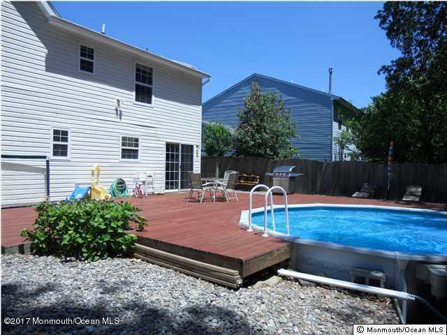 235 Timberline Road Toms River, NJ 08753 - Photo 3 of 4 a view of a backyard with sitting area