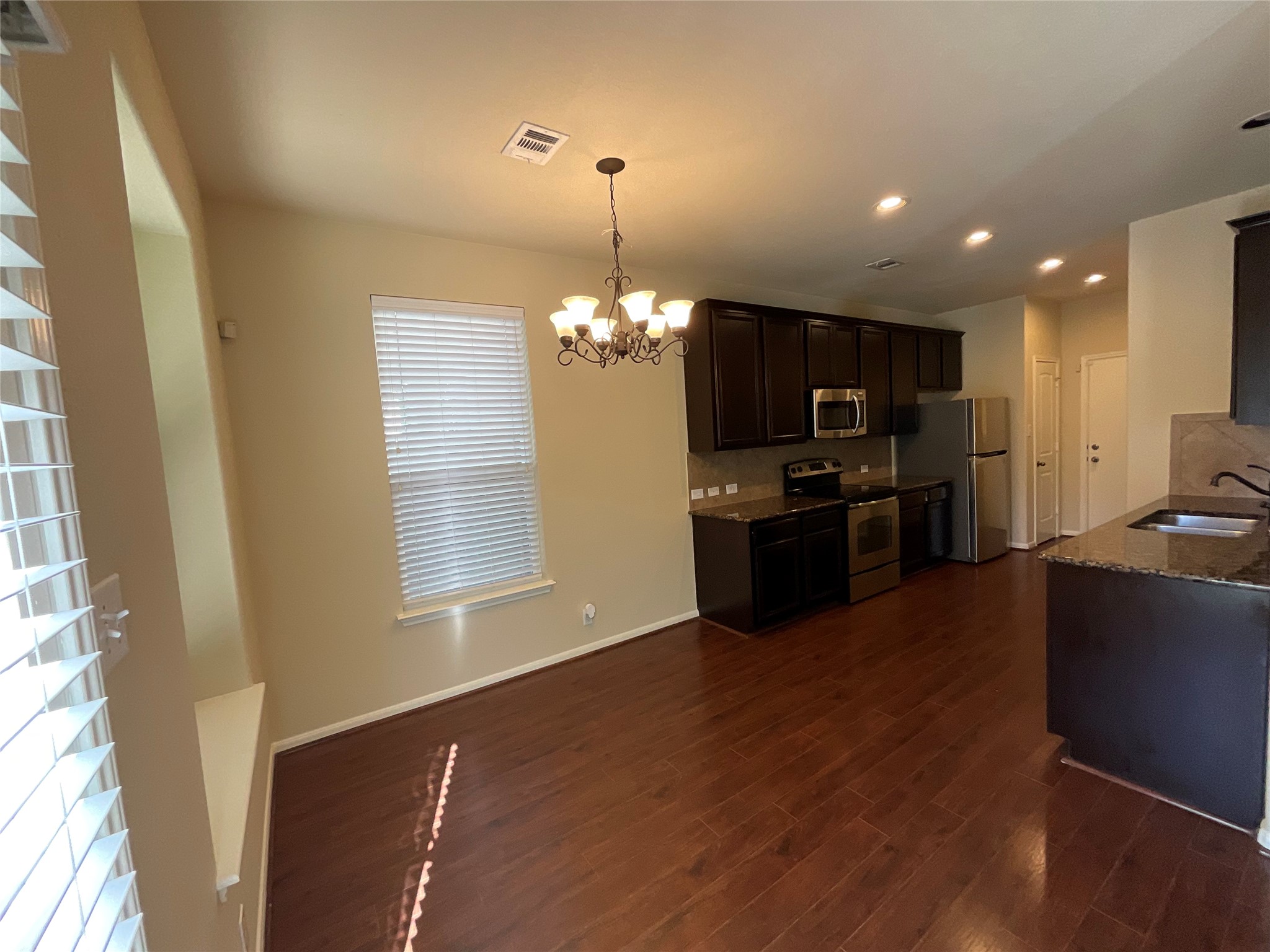 1911 Conn Creek Road Cedar Park, TX 78613 - Photo 13 of 39 a kitchen with refrigerator and microwave