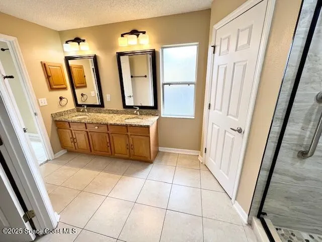 a bathroom with a mirror a bathtub and a sink