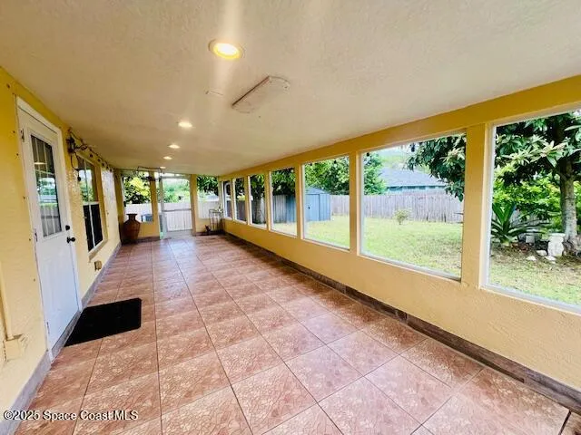 a lobby with furniture and floor to ceiling window