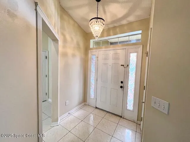 a view of a hallway with closet and entryway
