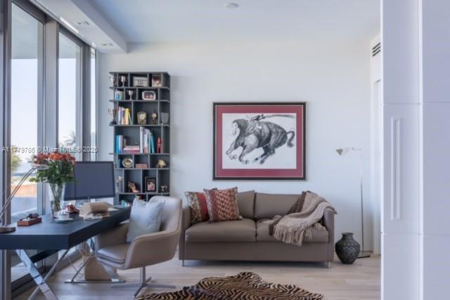 350 Ocean Drive, Unit 304N Key Biscayne, FL 33149 - Photo 22 of 69 open den with sleeper sofa and white sliding door for privacy