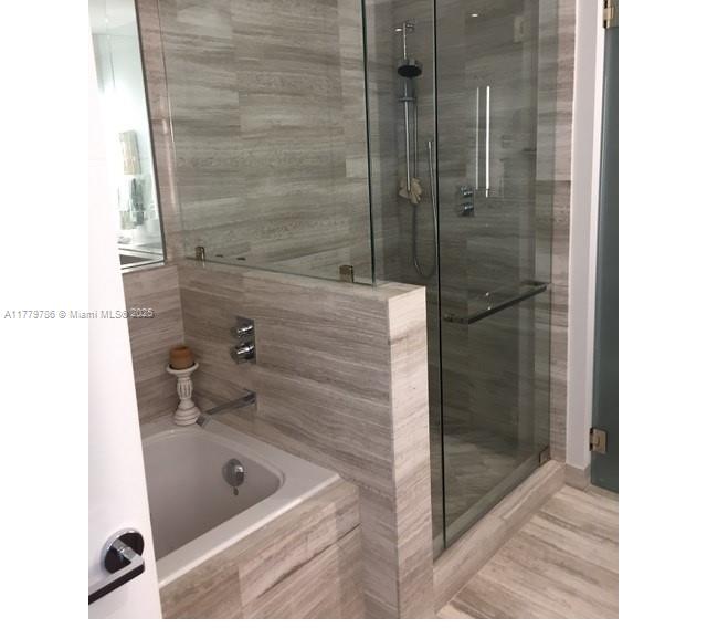350 Ocean Drive, Unit 304N Key Biscayne, FL 33149 - Photo 32 of 69 Master bathroom with jacuzzi and shower. Separate toilette area for privacy