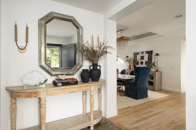 a view of living room and wooden floor