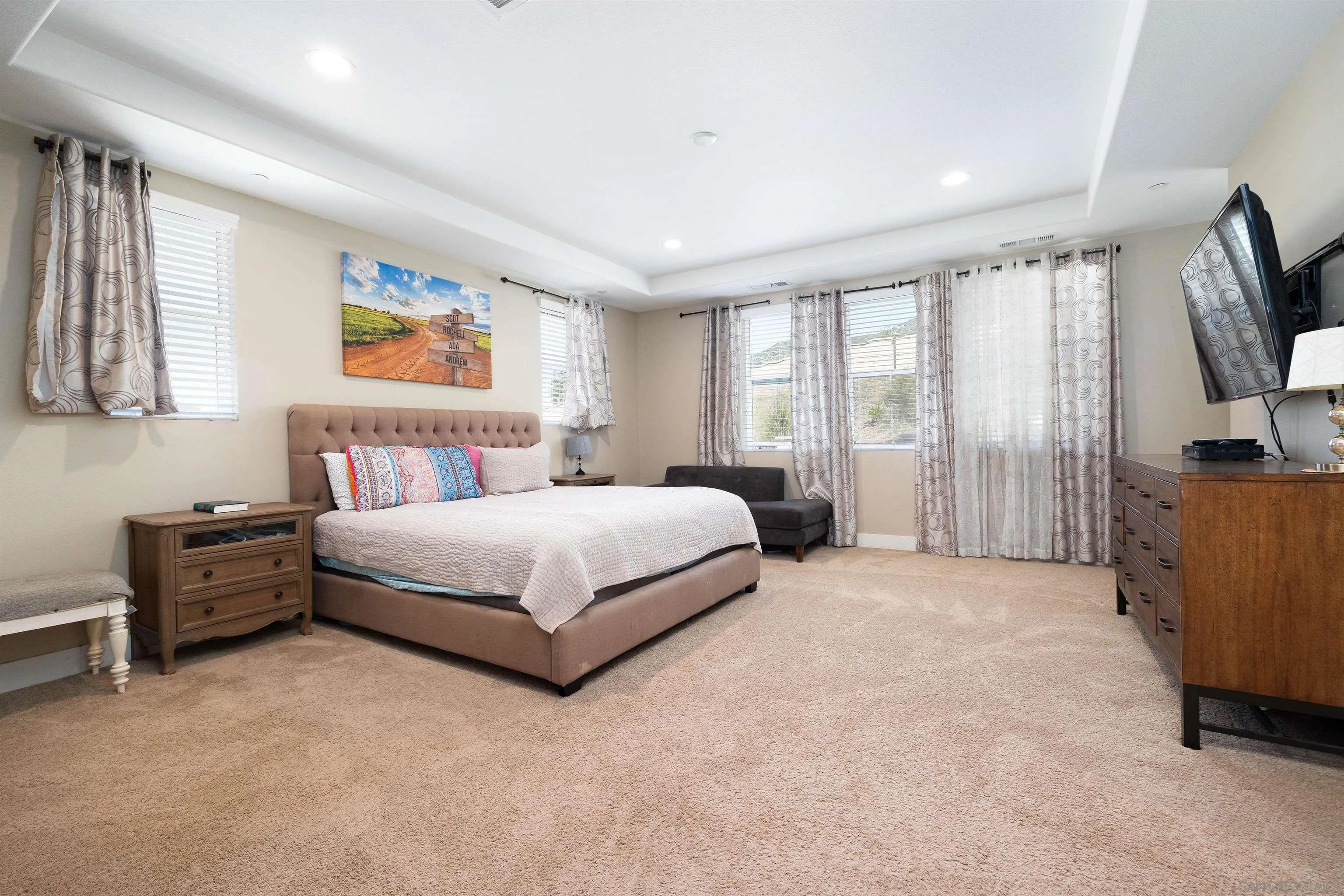 35763 Garrano Lane Fallbrook, CA 92028 - Photo 12 of 25 a bedroom with a bed flat screen tv and a large window