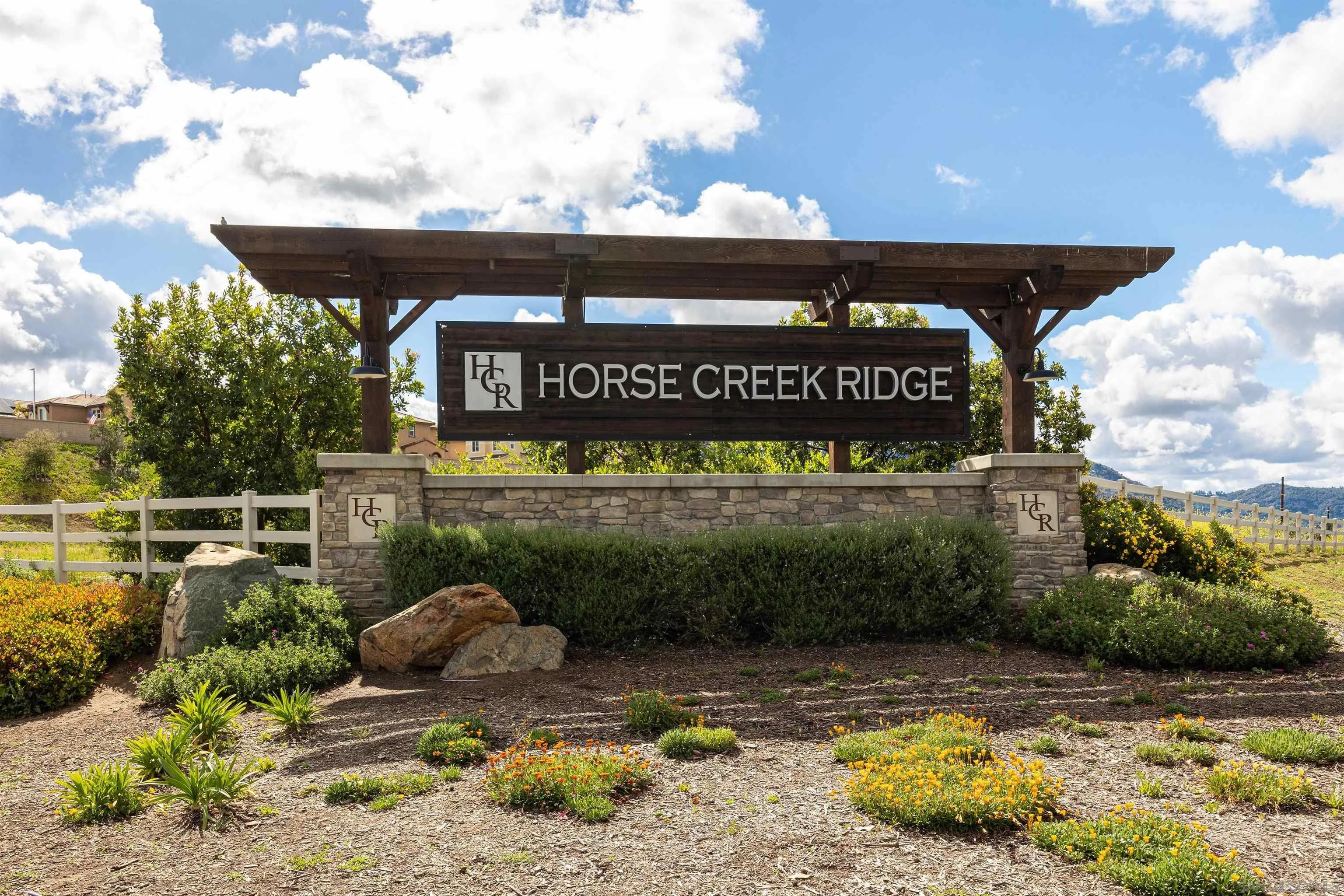 35763 Garrano Lane Fallbrook, CA 92028 - Photo 21 of 25 a sign that is sitting on a brick wall