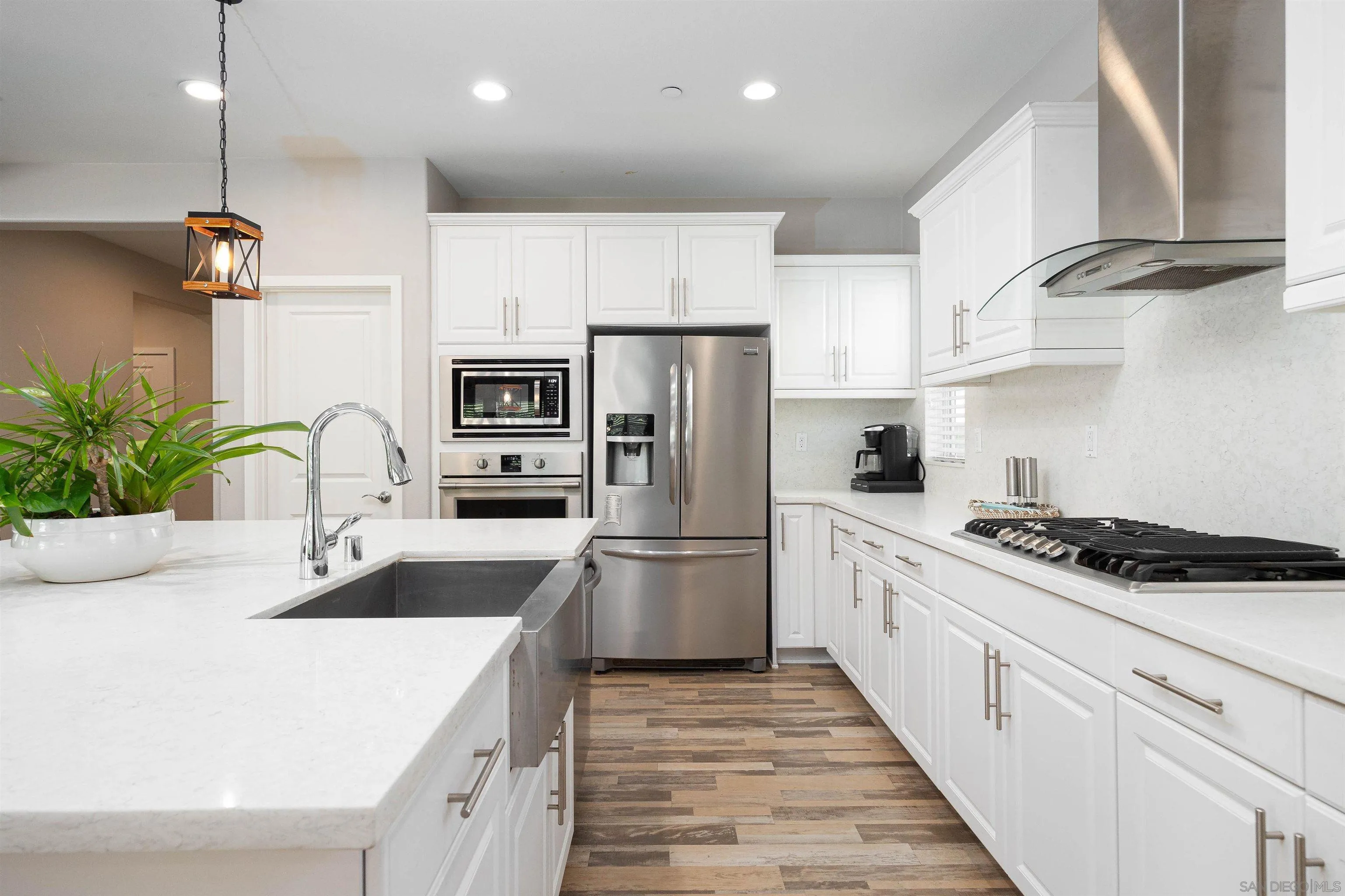35763 Garrano Lane Fallbrook, CA 92028 - Photo 4 of 25 a kitchen with a sink stainless steel appliances and counter space