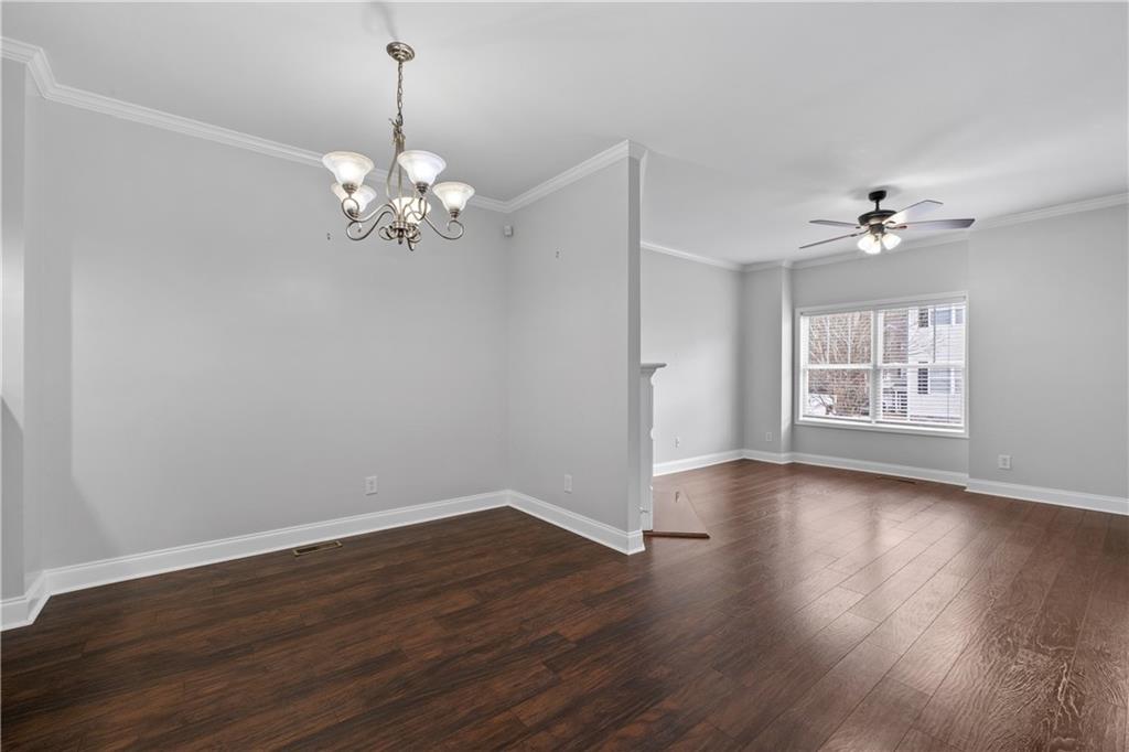 3072 Lauren Parc Road Decatur, GA 30032 - Photo 12 of 36 a view of a room with wooden floor and chandelier