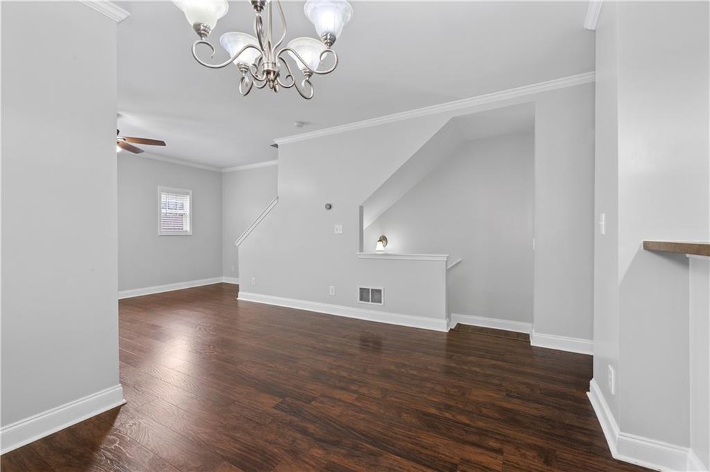 3072 Lauren Parc Road Decatur, GA 30032 - Photo 13 of 36 a view of empty room with wooden floor and ceiling fan