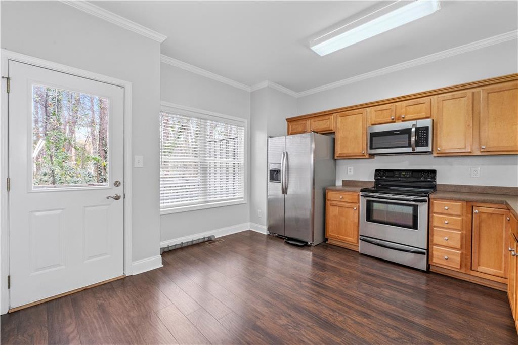 3072 Lauren Parc Road Decatur, GA 30032 - Photo 15 of 36 a kitchen with stainless steel appliances a refrigerator and a stove top oven